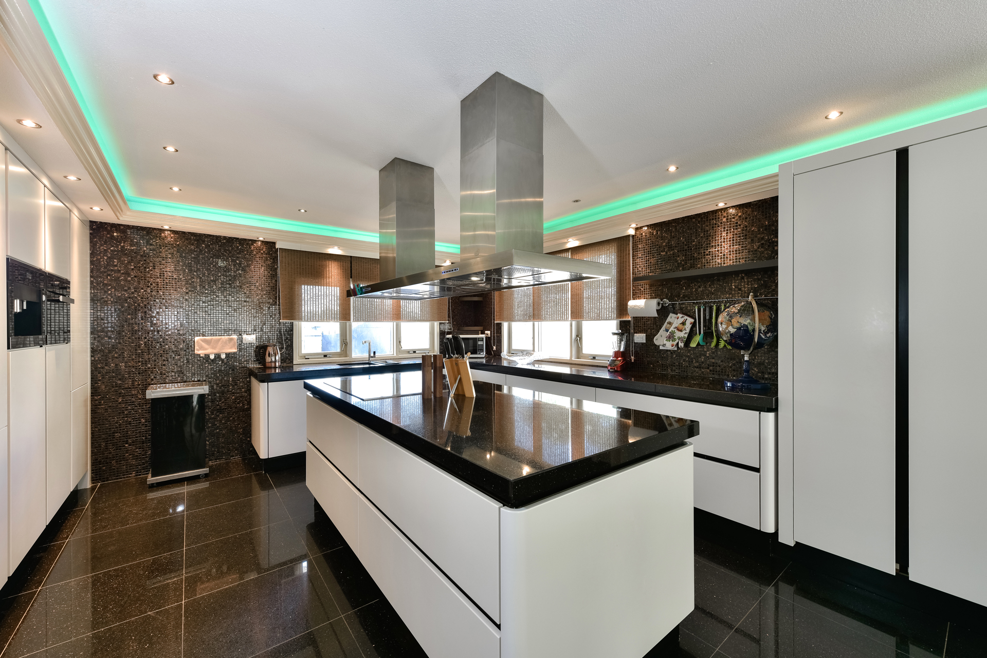 Modern kitchen with island and mood lighting